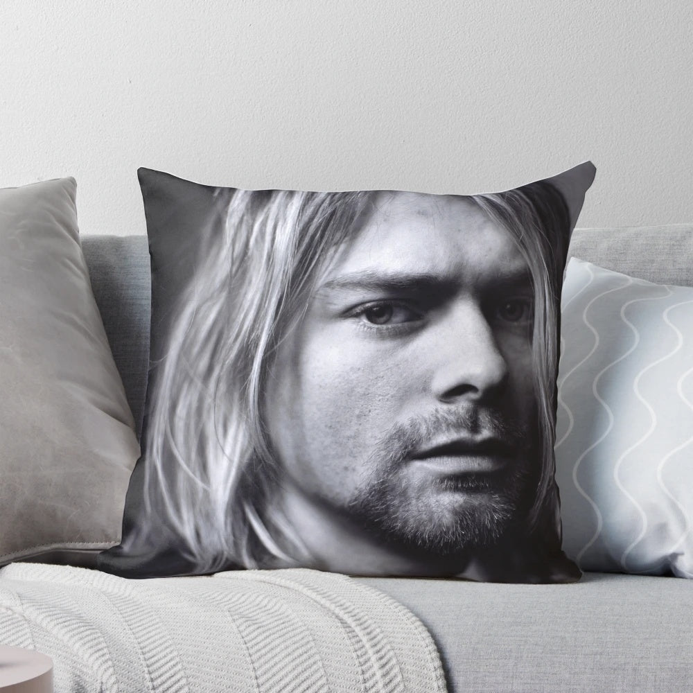 Vintage music poster pillow featuring a portrait of Kurt Cobain, the lead singer of the grunge band Nirvana.