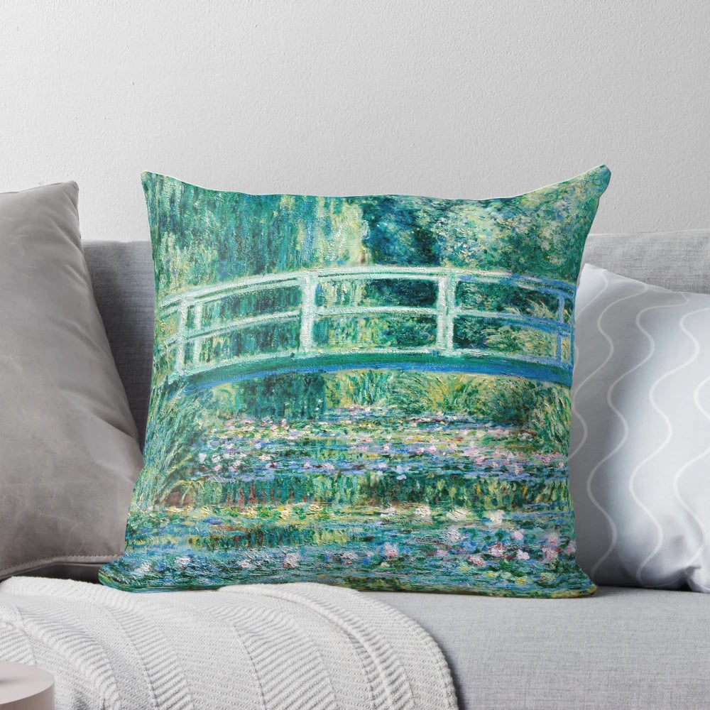 Vintage decorative pillow featuring Claude Monet's famous painting "Water Lilies and Japanese Bridge