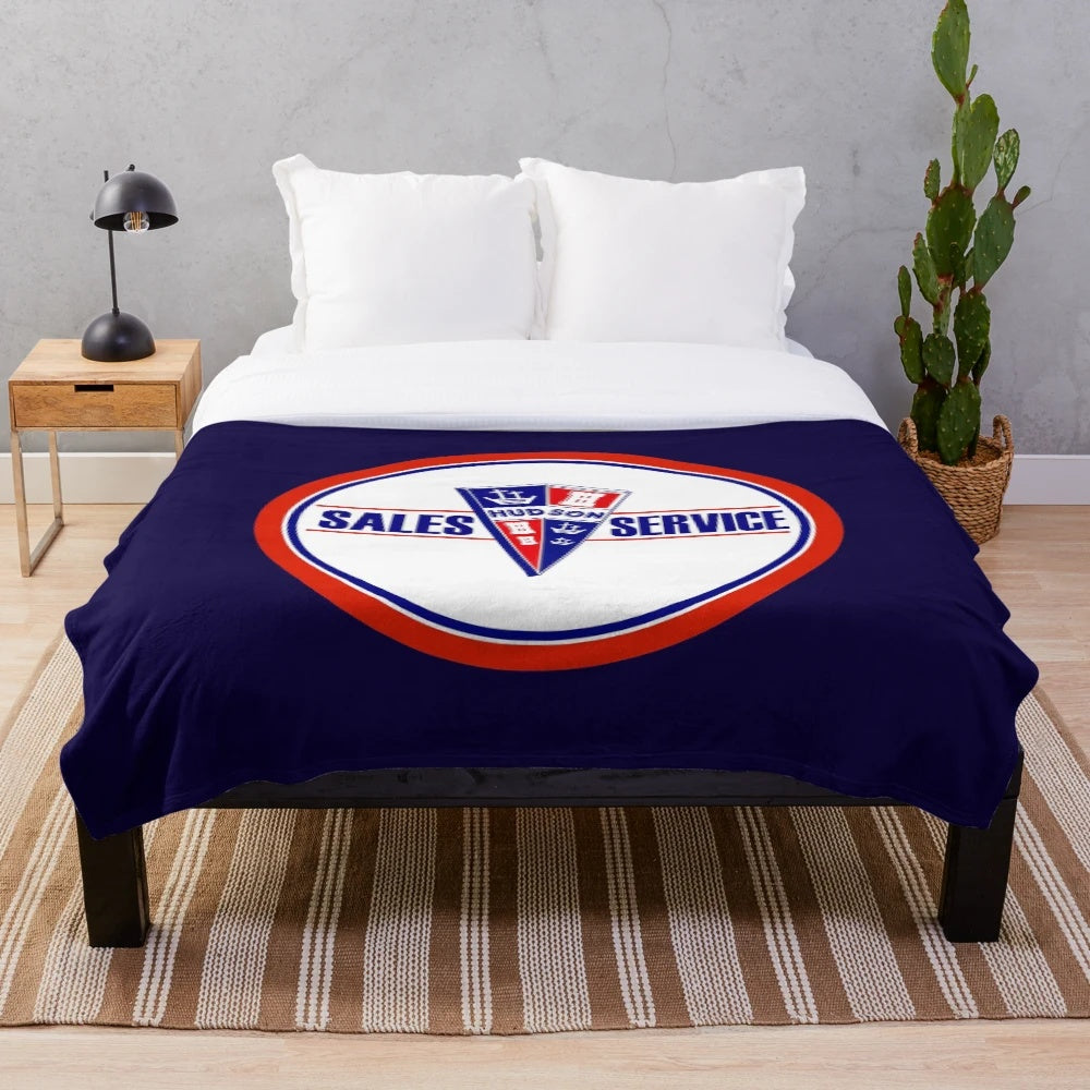 Vintage-inspired plush blanket featuring the Hudson Sales and Service logo