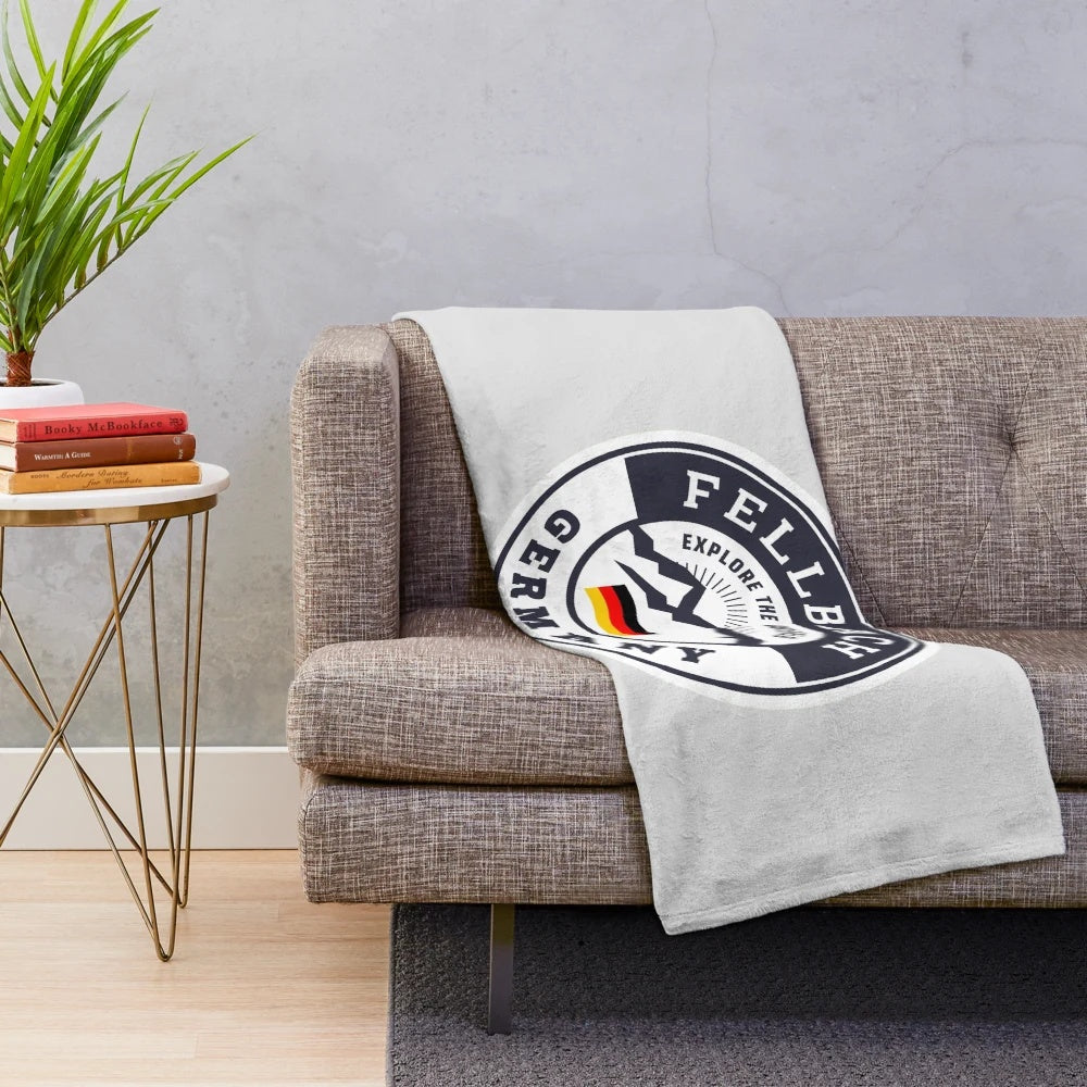 Plush blanket featuring a vintage-style German crest design