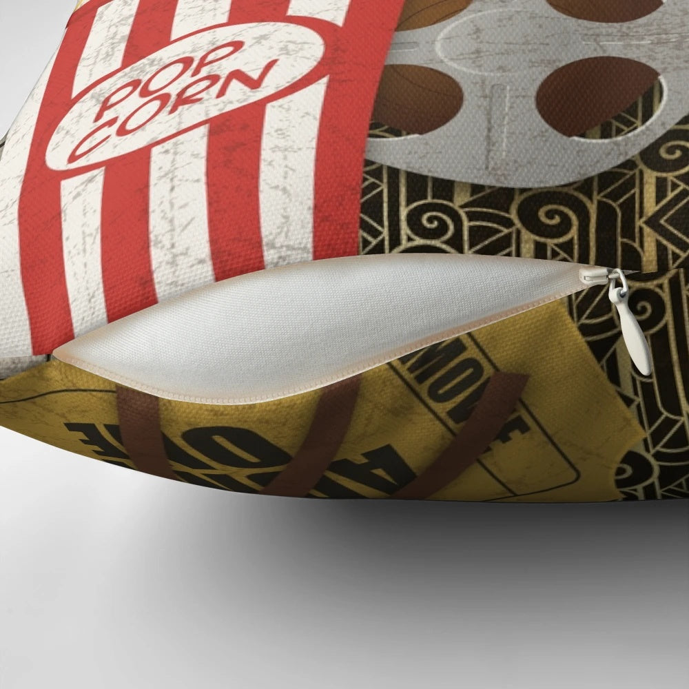 Vintage-inspired home movie-themed throw pillow with film strip, ticket, and movie camera design elements