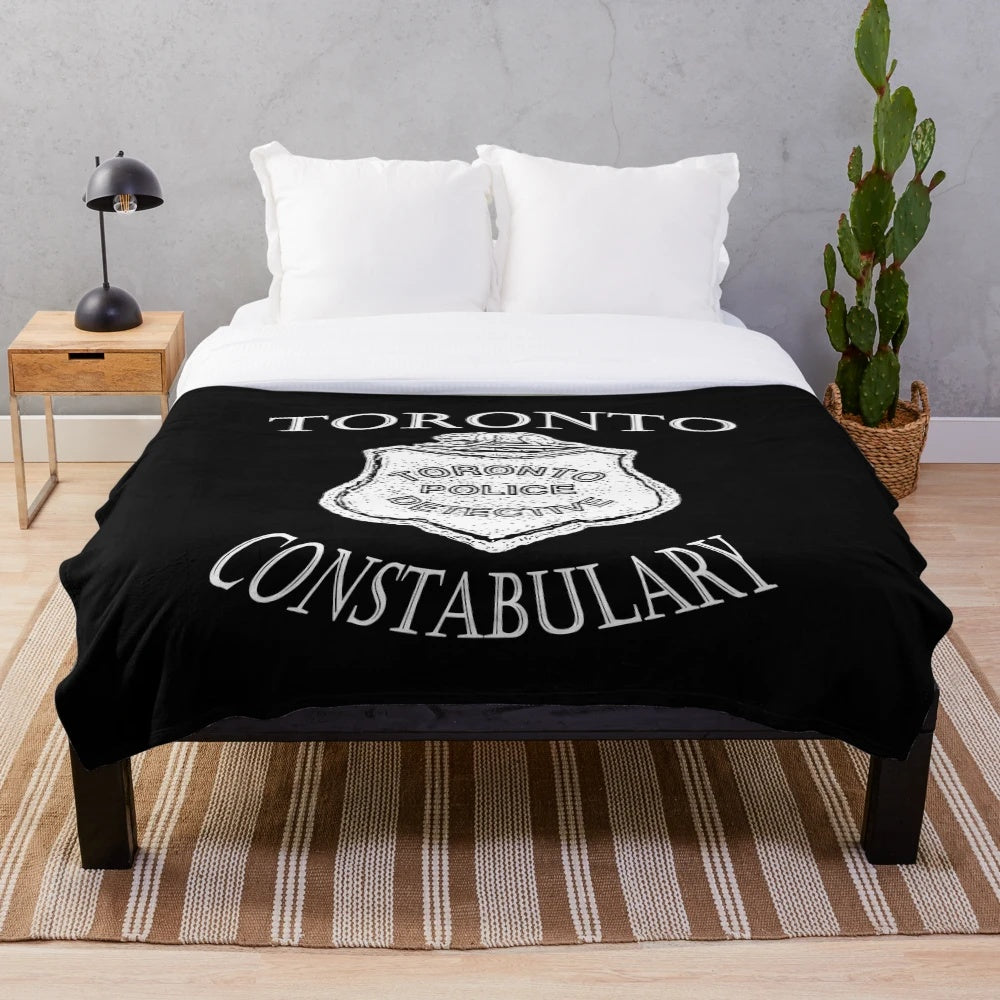 Vintage-inspired plush blanket featuring elements from the Canadian TV series Murdoch Mysteries