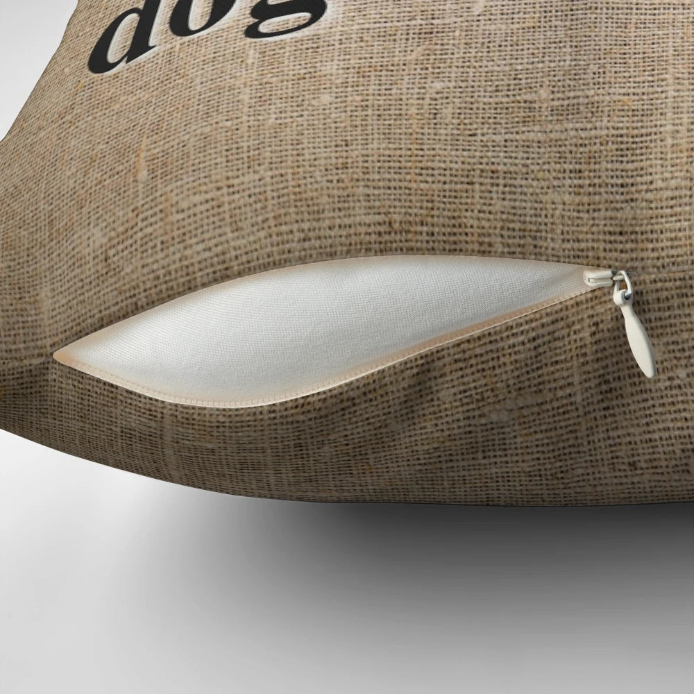 Vintage-inspired 'No Dogs on Sofa' throw pillow with retro text and natural textiles