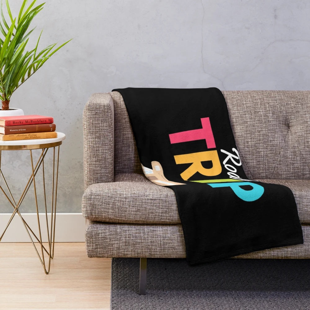 Vintage-inspired plush blanket featuring a retro travel theme