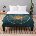 Vintage-style plush blanket featuring a sun and moon celestial art design
