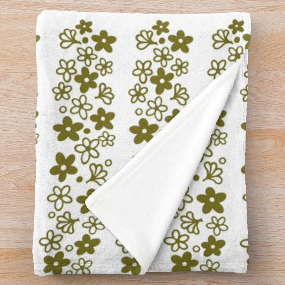 Vintage-inspired plush blanket featuring the iconic Pyrex Spring Blossom design in a cozy avocado green color