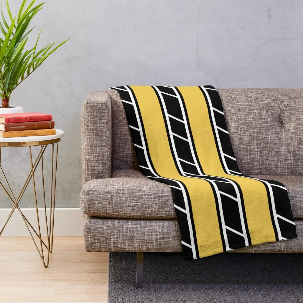 Retro-style plush blanket in black and yellow with classic motorcycle graphics