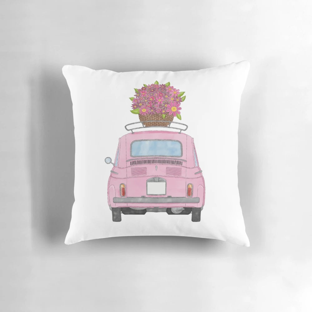 A pink Fiat 500 classic car illustrated with watercolor flowers on a decorative throw pillow.