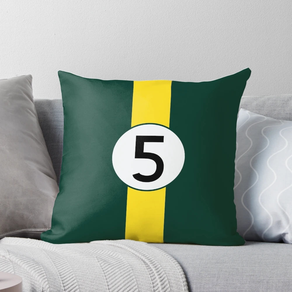 Pillow featuring the vintage green and yellow livery of the iconic Lotus 49 Formula One racing car driven by champion Jim Clark.