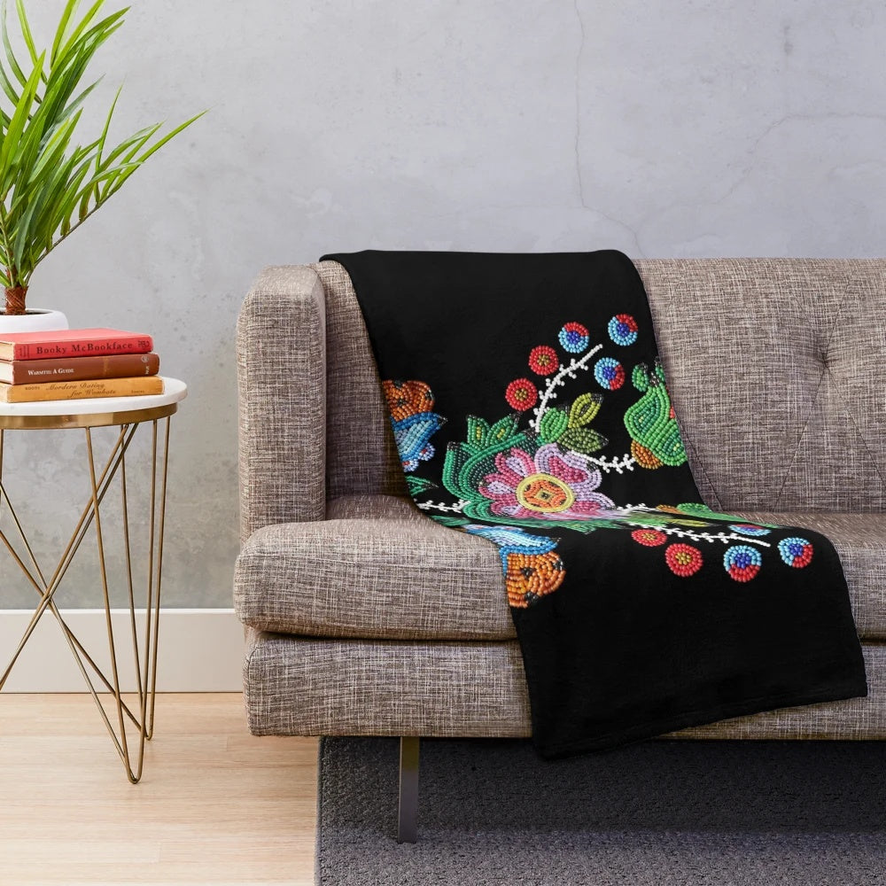 Vintage-style plush blanket with traditional Metis beadwork design