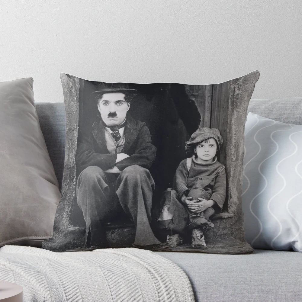 Vintage pillow featuring Charlie Chaplin and Jackie Coogan in the classic silent film "The Kid