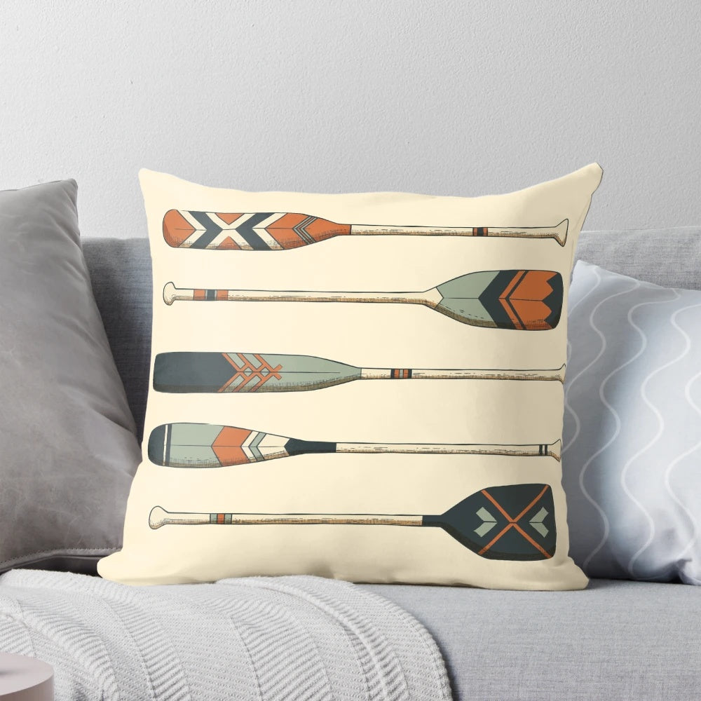 Vintage wooden oars printed on a decorative throw pillow for nautical home decor