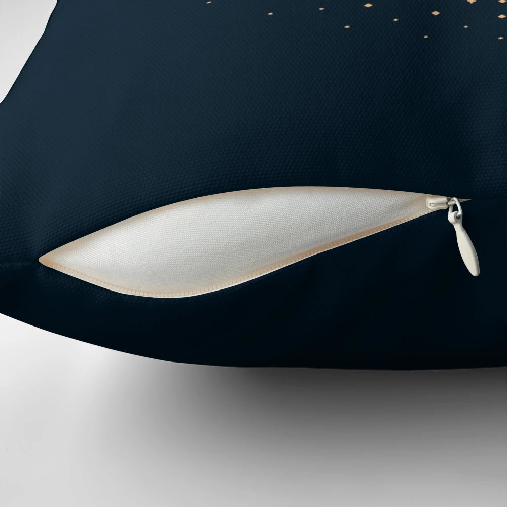 Vintage paper crane design on a navy blue pillow with a starry night sky