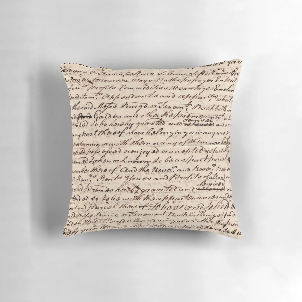 A vintage-style letter pillow with a handwritten calligraphy design, perfect for dark academia home decor.