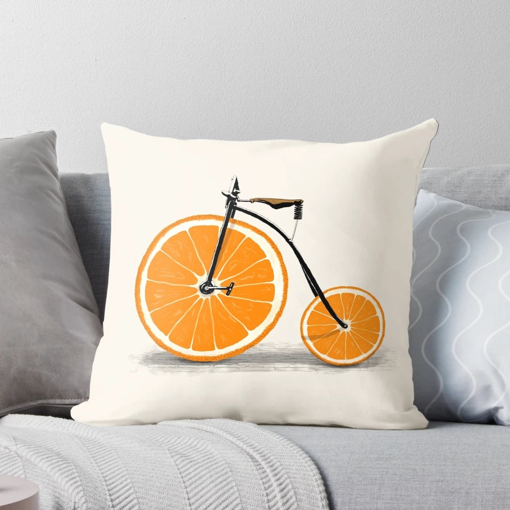 Vintage penny farthing bicycle with a juicy orange graphic on a plush pillow