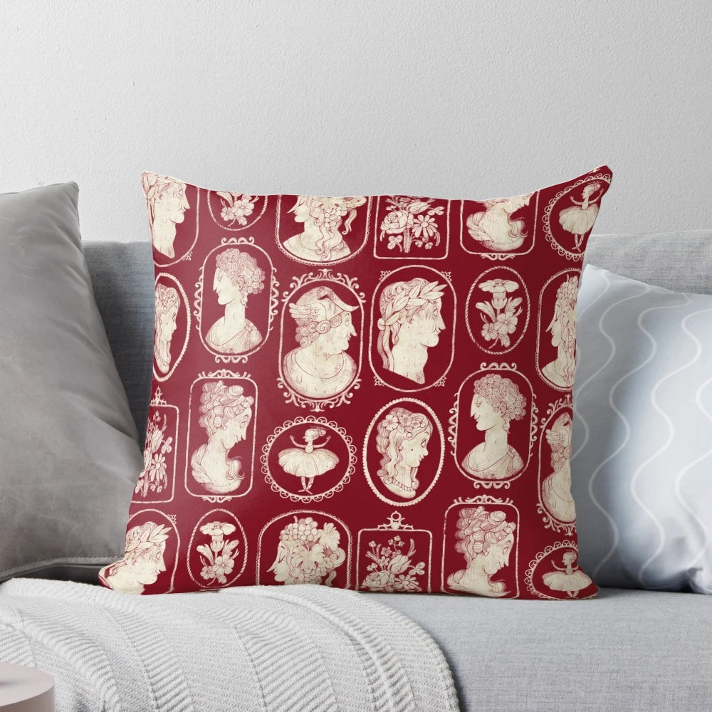 Vintage red cameo pillow with floral and Victorian-inspired design