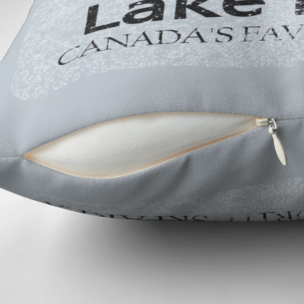 Vintage ski-themed decorative throw pillow with distressed mountain landscape of Lake Louise, Banff, Canada.