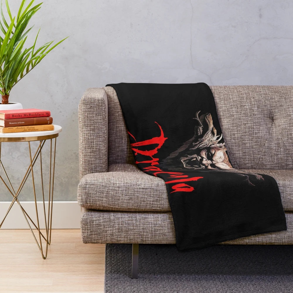 Vintage-style plush blanket featuring Dracula movie imagery