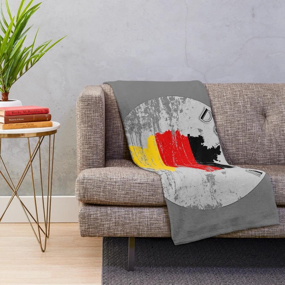 Vintage-style plush blanket featuring the German flag design for cozy home decor