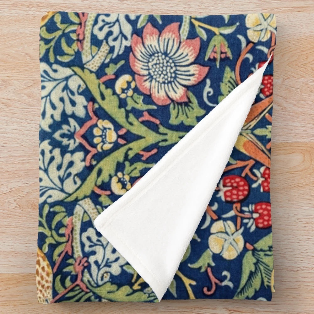 Plush blanket featuring the Strawberry Thief floral pattern by William Morris