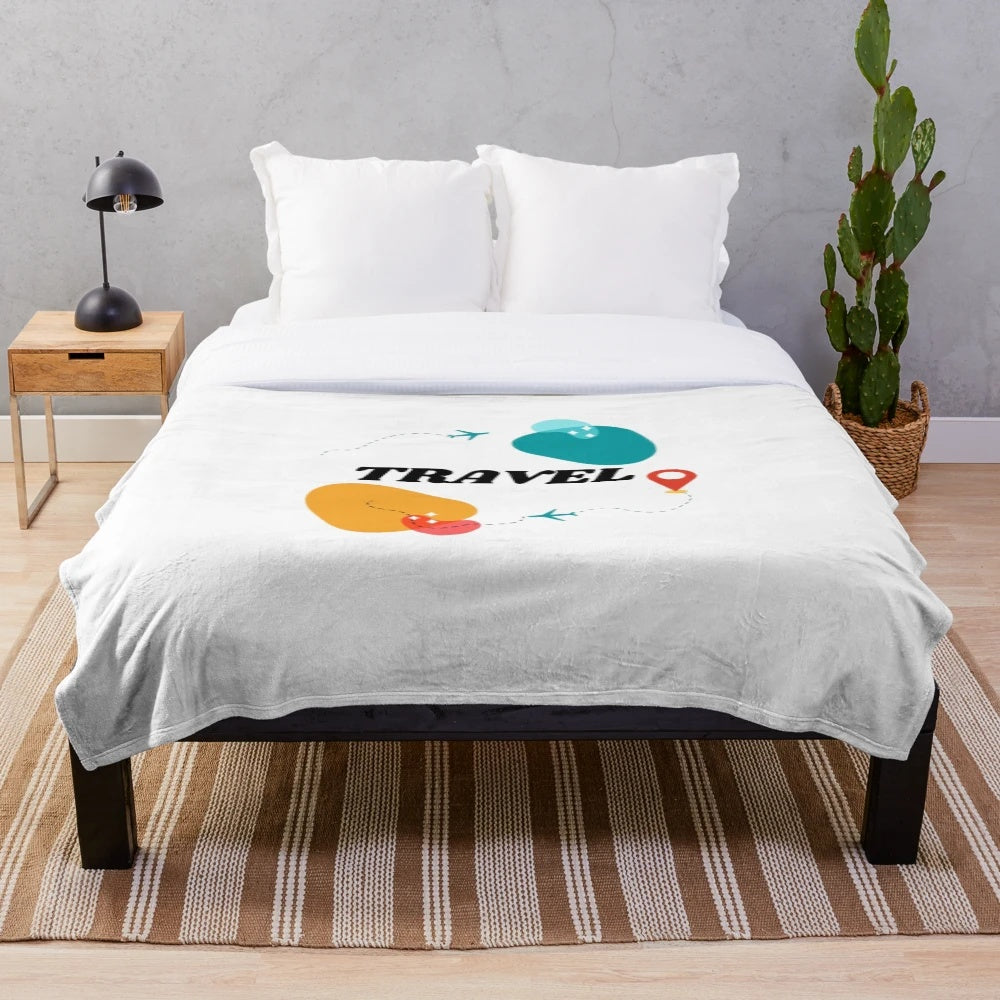 Vintage travel inspired plush blanket featuring an airplane design