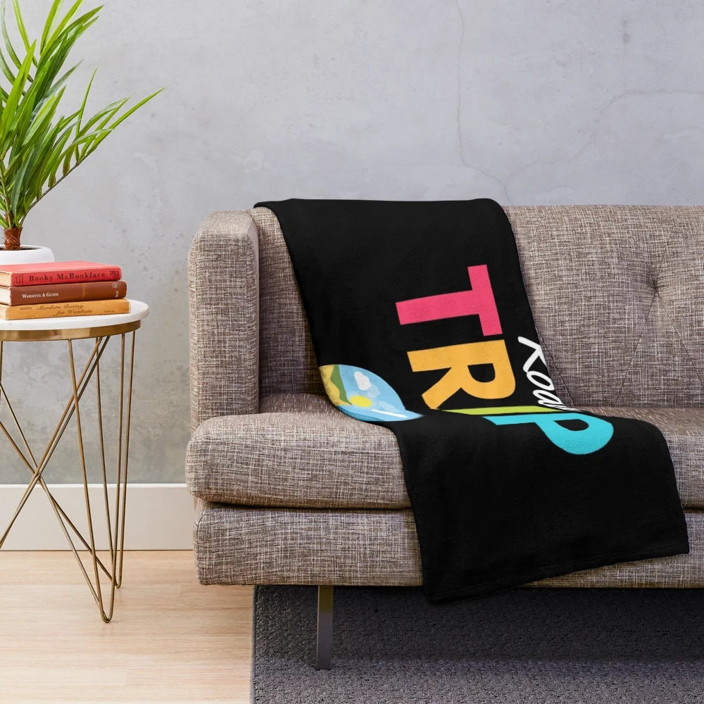 Vintage travel-inspired plush blanket with mountain and forest design