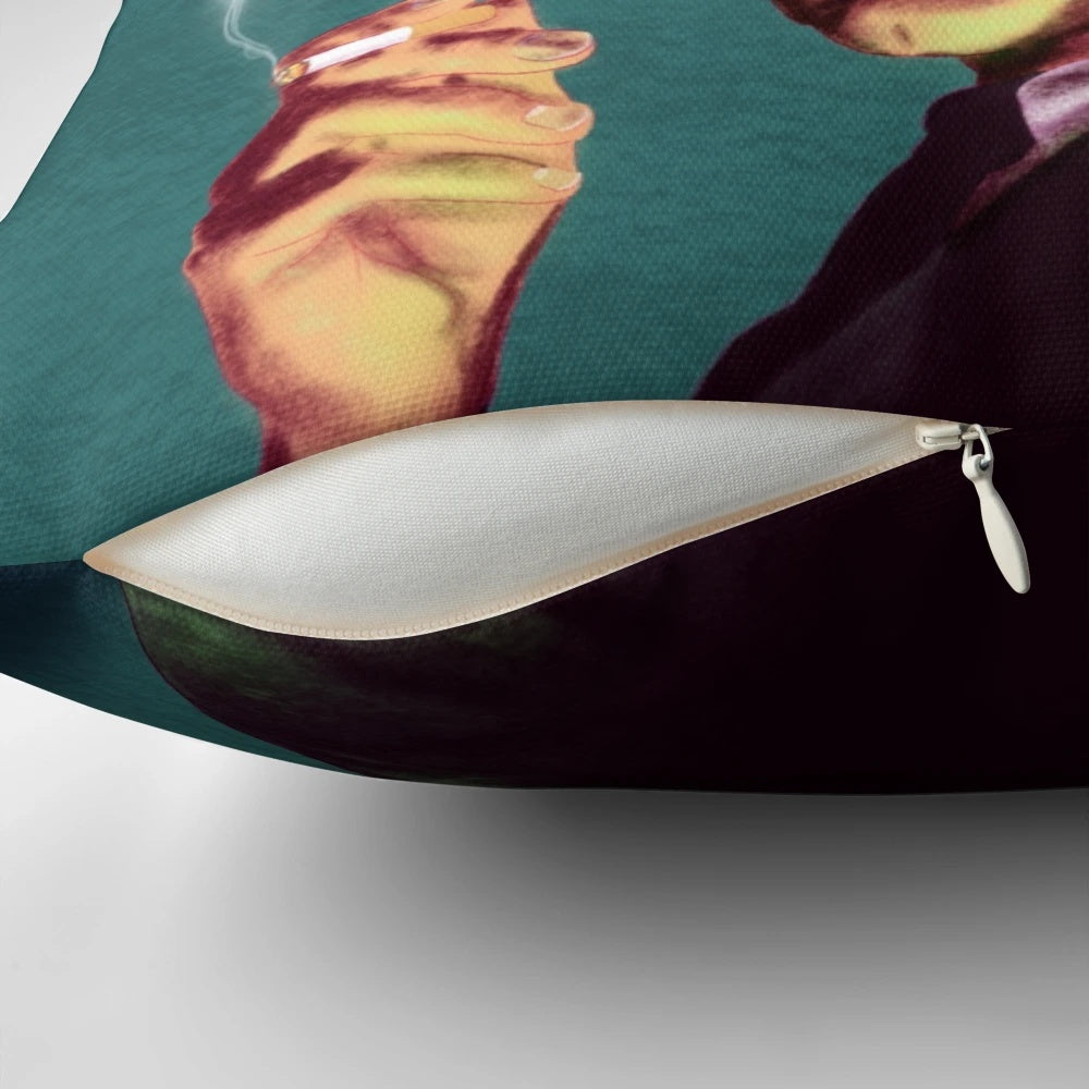 A vintage-style pillow featuring an image of the iconic horror actor Vincent Price, surrounded by bats, smoke, and a cigarette.