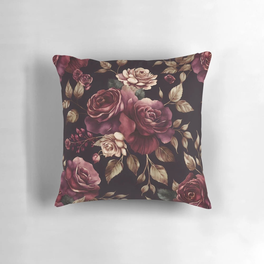 Vintage-style abstract watercolor painting of burgundy roses and botanical garden flowers on a decorative throw pillow