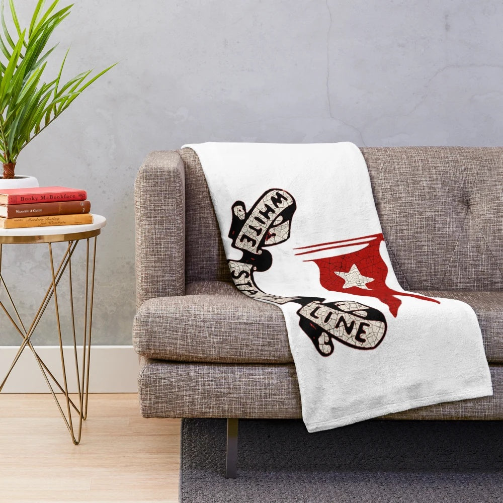 A soft, plush blanket with the iconic White Star Line logo and vintage design.