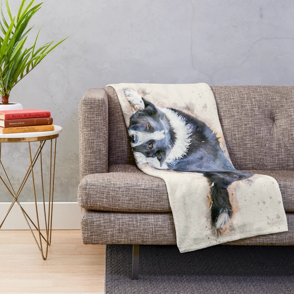 Watercolor portrait of a cute border collie dog on a plush blanket