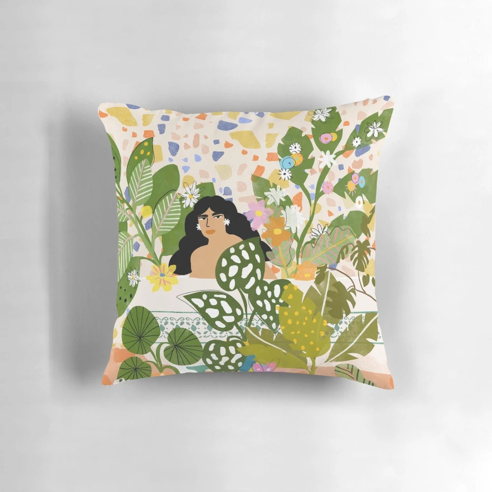 A colorful watercolor painting-inspired floral and botanical pattern pillow for the bathroom