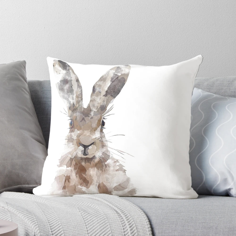 Watercolor painting of a brown hare on a throw pillow