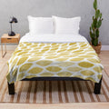 Watercolor brush strokes plush blanket in yellow and ochre tones