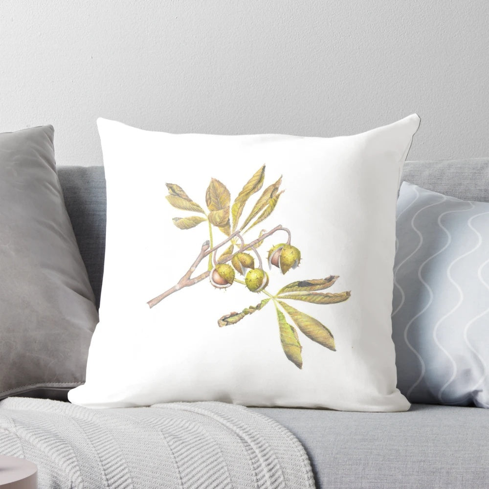 A watercolor illustration of horse chestnut leaves and conkers on a decorative pillow.