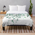 Watercolor painting of ivy plants climbing on a wall, printed on a soft plush blanket