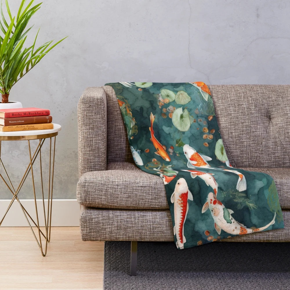 Watercolor koi fish pond design on a plush blanket