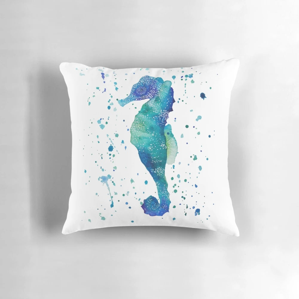 Watercolor painting of a seahorse on a decorative throw pillow