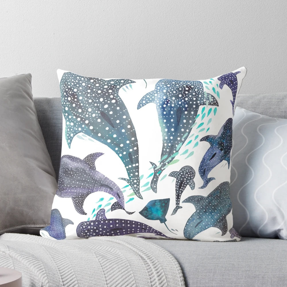 Decorative throw pillow featuring a watercolor-style illustration of a whale shark, ray, and other marine life.