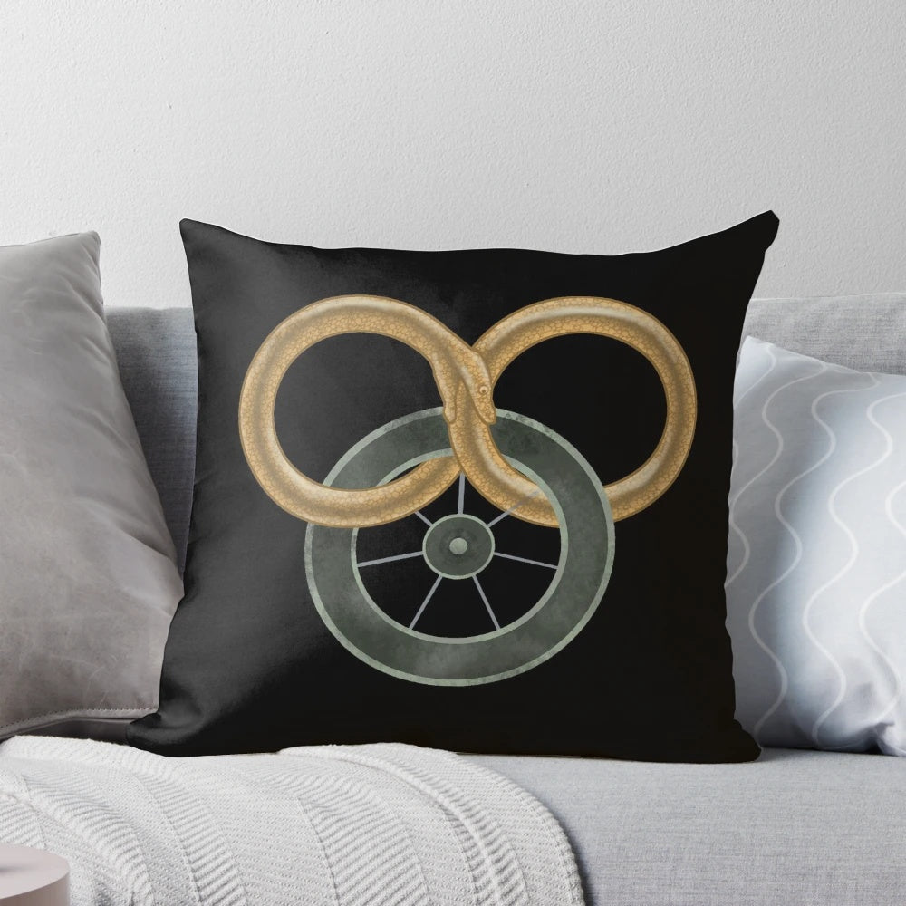 Stylized illustration of the Wheel of Time symbol on a decorative throw pillow