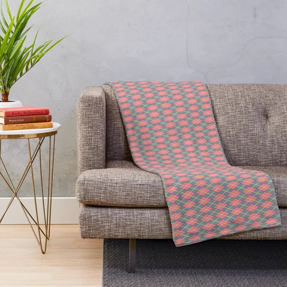 Whimsical argyle plush blanket in pink, gray, and gold