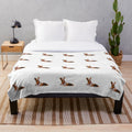 Plush blanket featuring a whimsical fox design inspired by legendary animal artwork