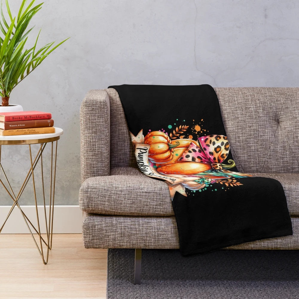 Whimsical watercolor pumpkin illustration on a cozy plush blanket for fall decor