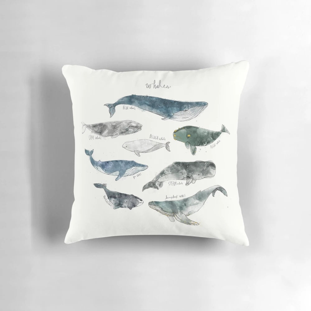 Colorful watercolor painting of whales on a soft, cozy pillow